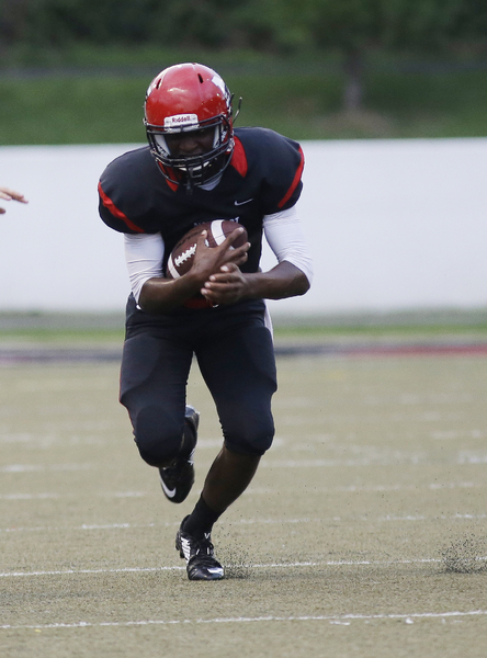 Newport's  Paul Price runs the ball , during their football game, Friday, Aug. 30,2014. 