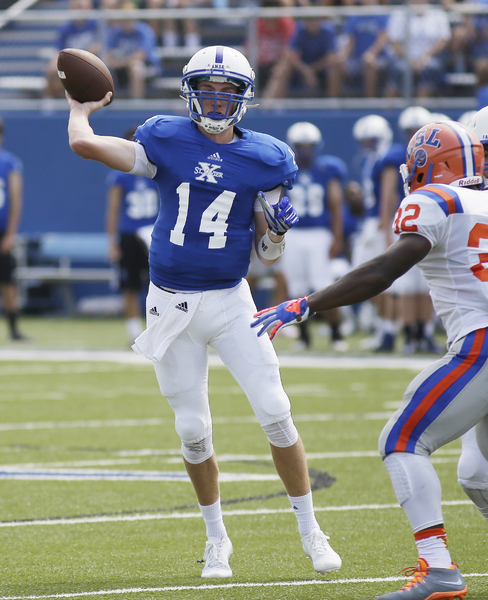 St. Xavier's Sean Clifford throws the ball during the Bombers football game against East St. Loui