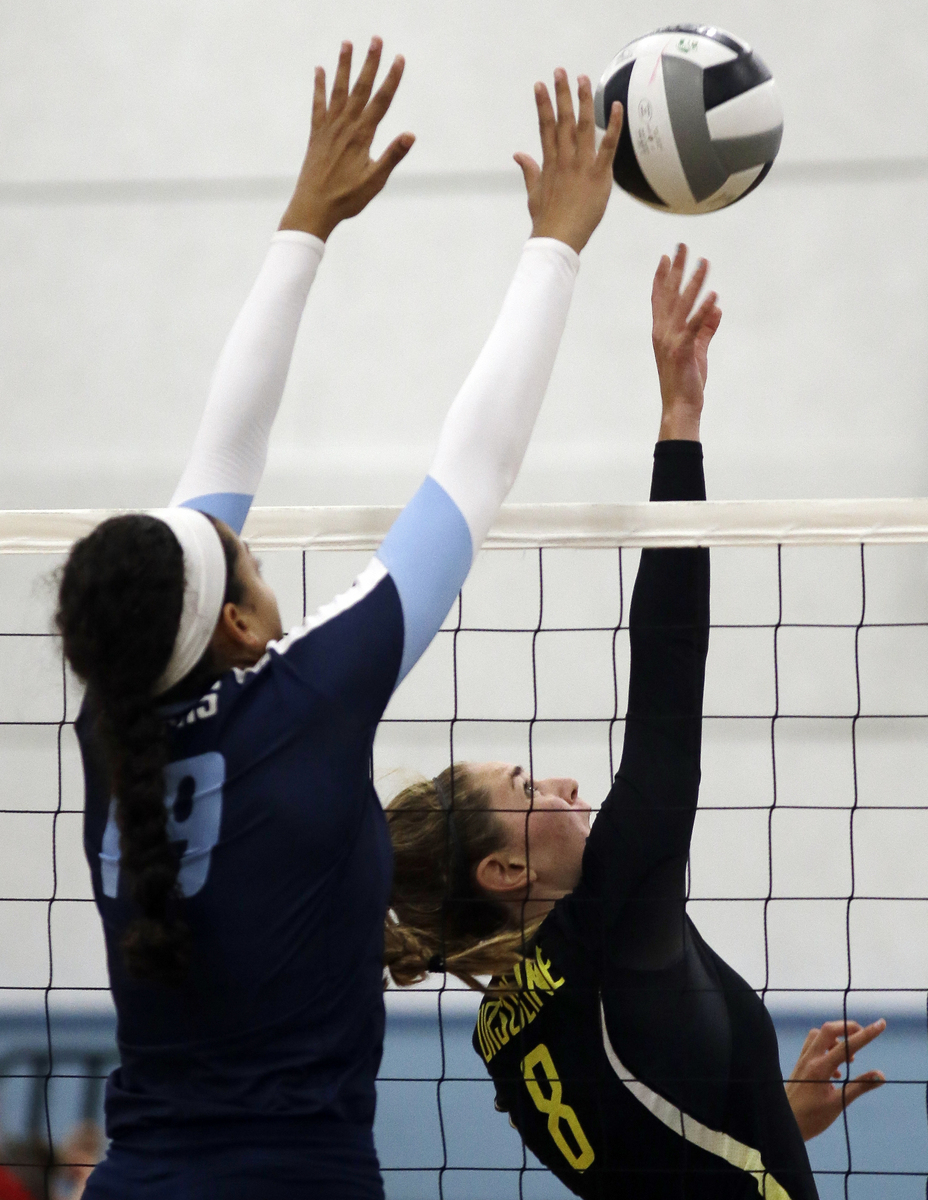 Ursuline's Alyssa Steller (8) attempts to get the ball past Mount Notre Dame's Sydney Mukes. 