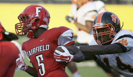 Fairfield's Cedric Woods runs away from Withrow's  Devonte Martin
