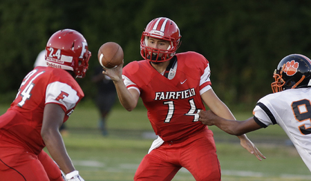 Fairfield's Hunter Krause passes the ball under pressure to Kesean Gamble.