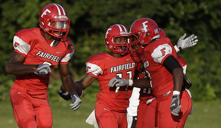 James Mitchell celebrates with his teamates after scoring a touchdown. 