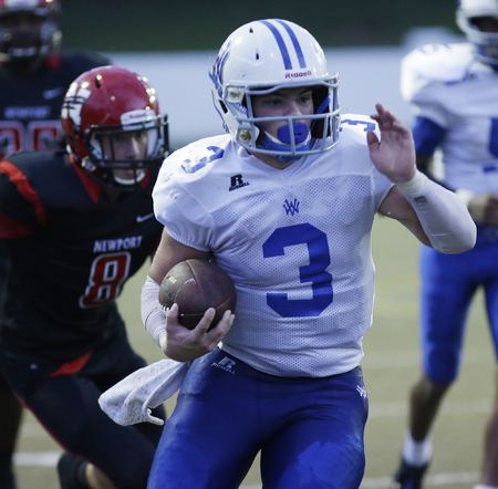 Walton Verona's Mason Compton runs the ball during their football game against Newport. 