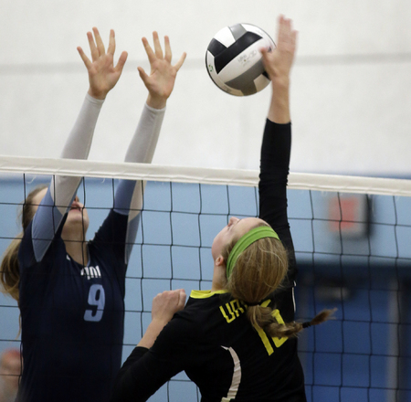 Ursuline's Katherine Edmondson(15) attempts to get ball past Mount Notre Dame's Christine Carroll. 