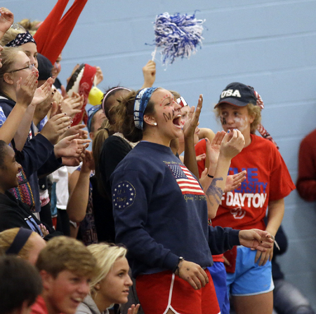 Mount Notre Dame fans celebrate during the Cougars Volleyball game against Ursuline. (