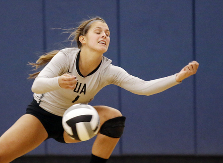 Ursuline's Avery Naylor  attempts to  save the ball during the Lions volleyball game against Mount Notre Dame,